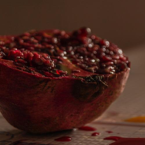 An image of a messily cut open pomegranate