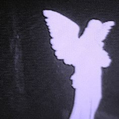an image of a purple-white angel silhouette on a tv screen